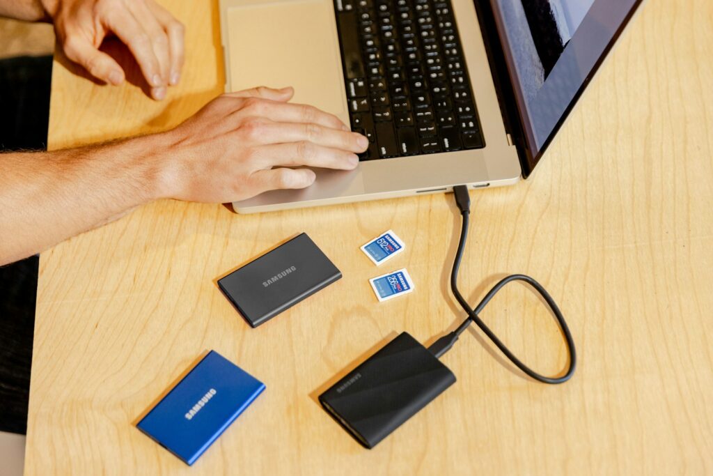 A person sitting at a table with a laptop